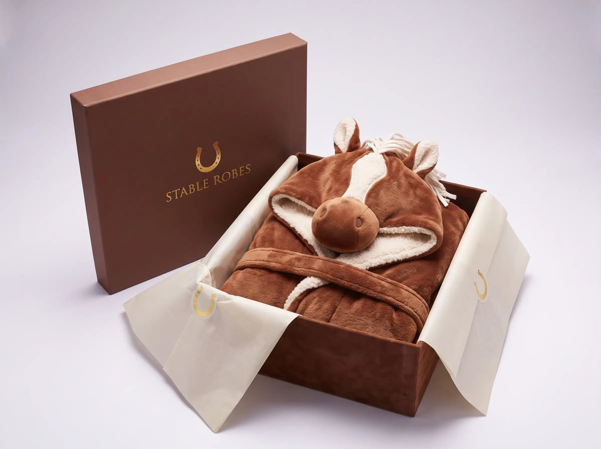 Stable Robe gift box open with robe in cream tissue